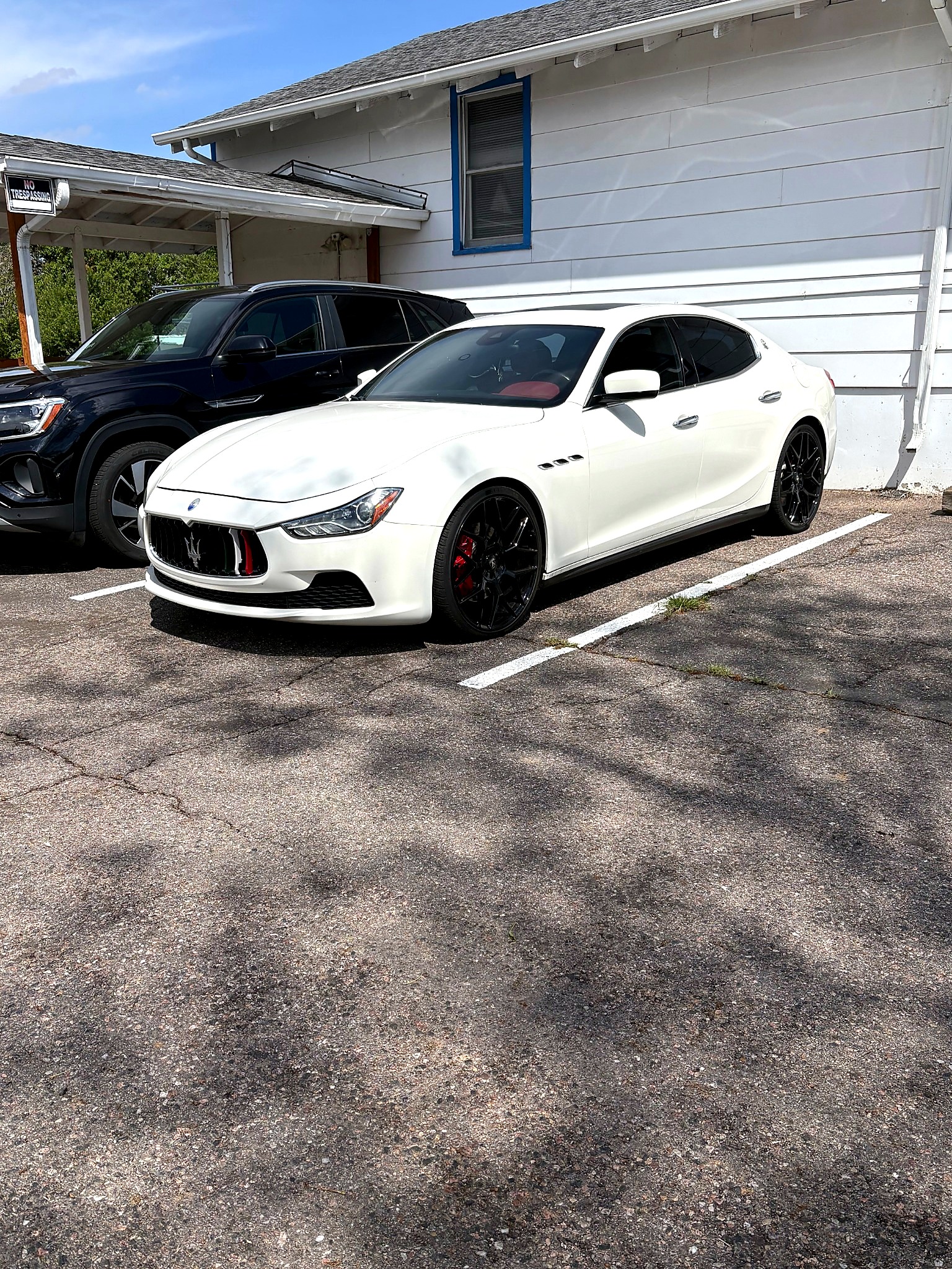White Maserati luxury sedan full exterior view in lot