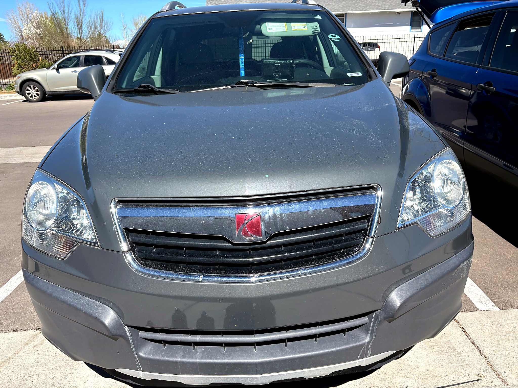 Gray SUV headlight after restoration with improved clarity