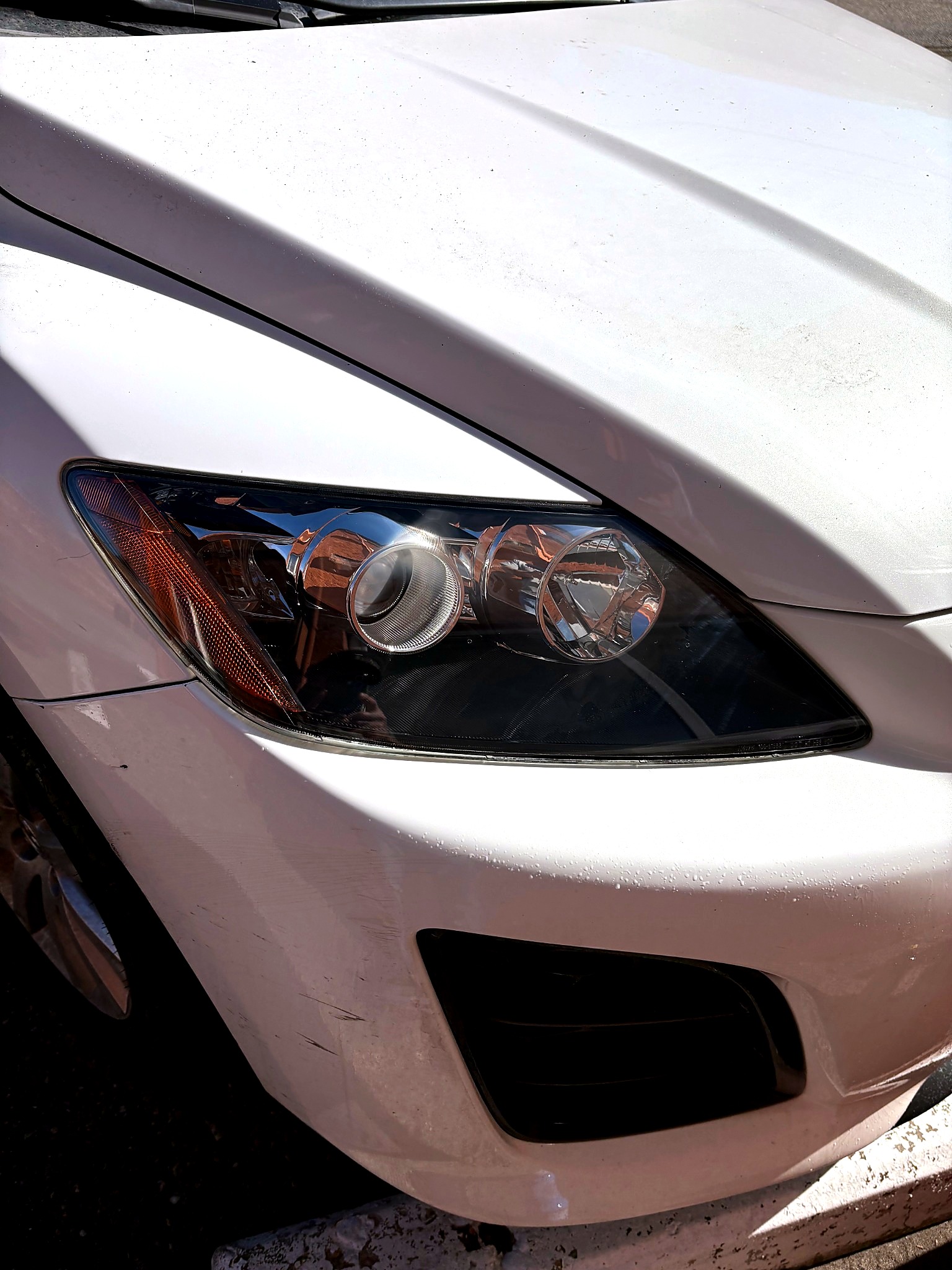 White vehicle headlight after restoration