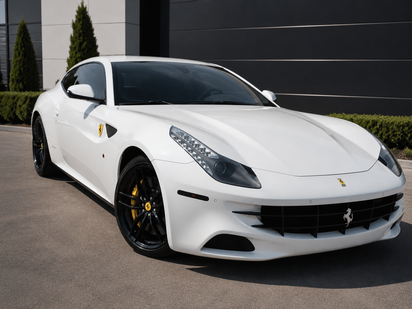 White Ferrari FF side profile at Praus Automotive